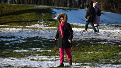 People walk in a park in Moscow, Russia.